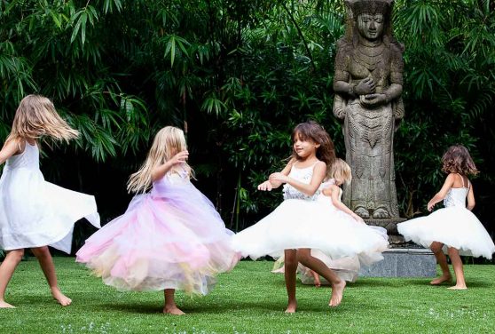 Jan Desai's children twirling in the garden with their friends | JanDesai.com